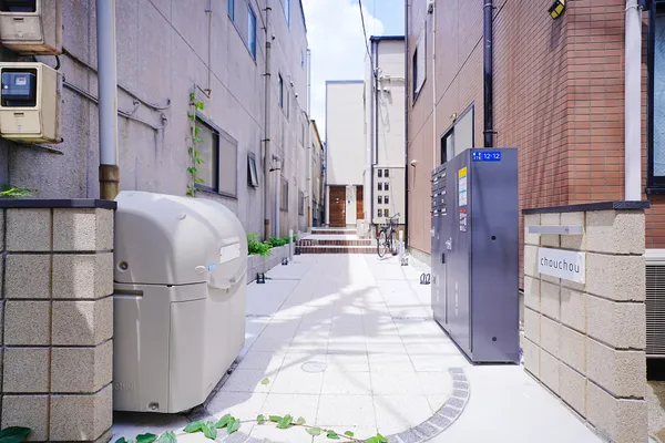 Narrow alley entrance between buildings