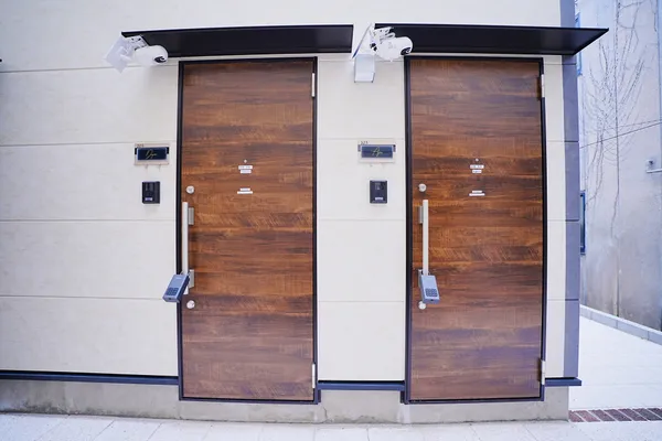 Room 101 and 103 wooden doors at the end of the alley